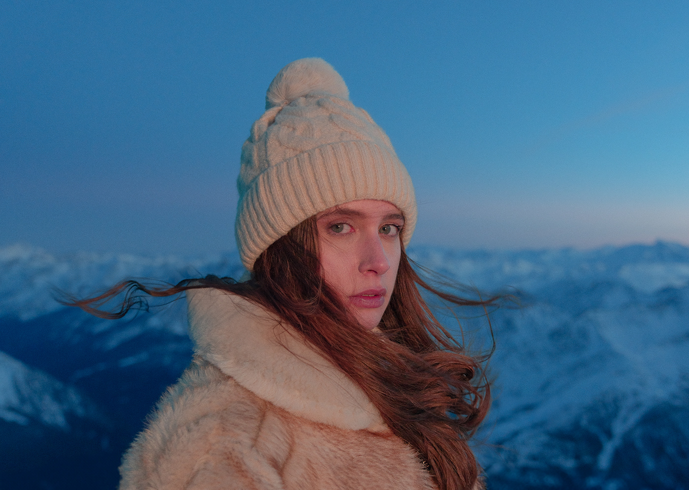 portrait of a woman from the skyway monte bianco, the italian alps at blue hour