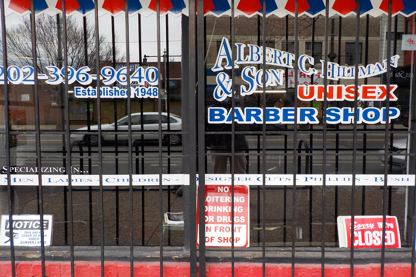 The popular Hillman & Son barbershop is one of the few black-owned-and-operated businesses that survived the gentrification of H Street NE corridor. The barbershop is temporarily closed because it isn't classified as an essential business operation during the COVID-19 pandemic.  (Joseph Young)