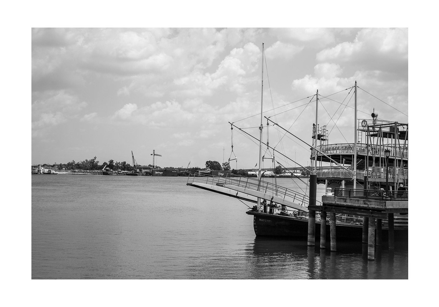 A historic ship docked on the Mississippi River in the New Orleans French Quarter.