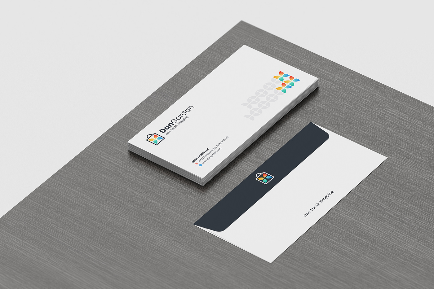 Envelope Mock-up, perspective view, sitting on a dark wooden desk corner, with a white background.