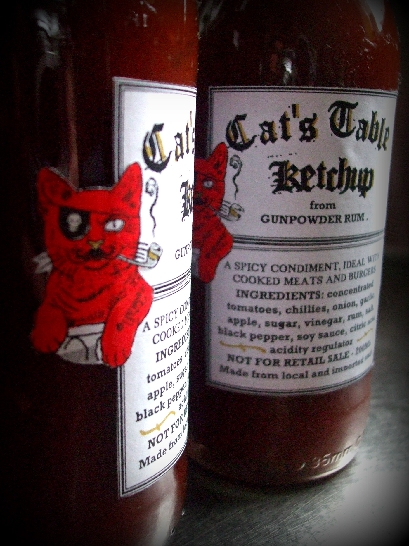 Rum ketchup spicy chillies Label brand font Cat pirate sauce