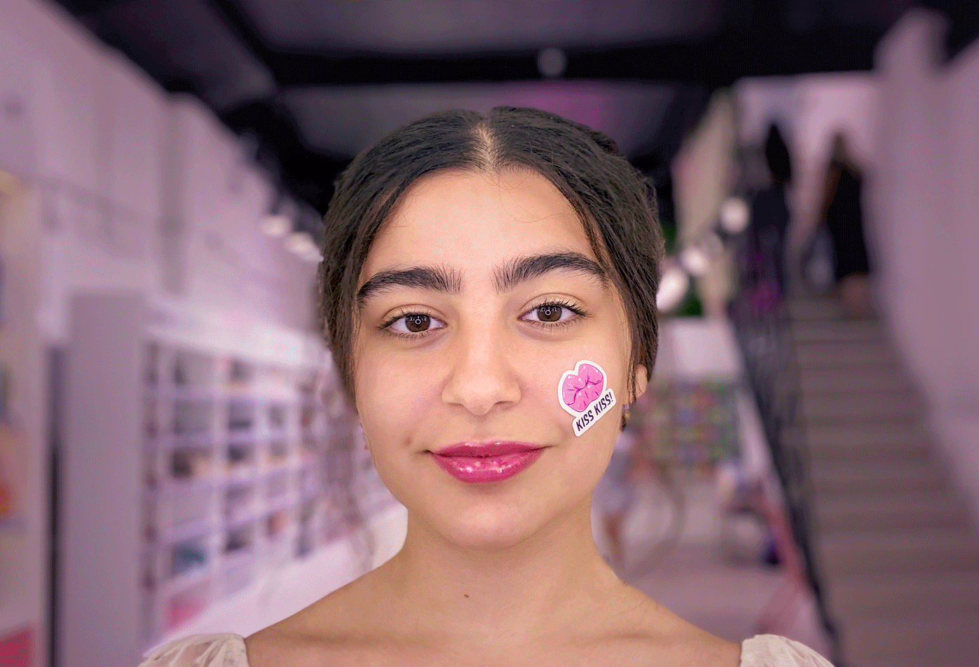 a GIF of a girl wearing stickers designed by Nune Nineveh Khachatryan in Adobe Illustrator