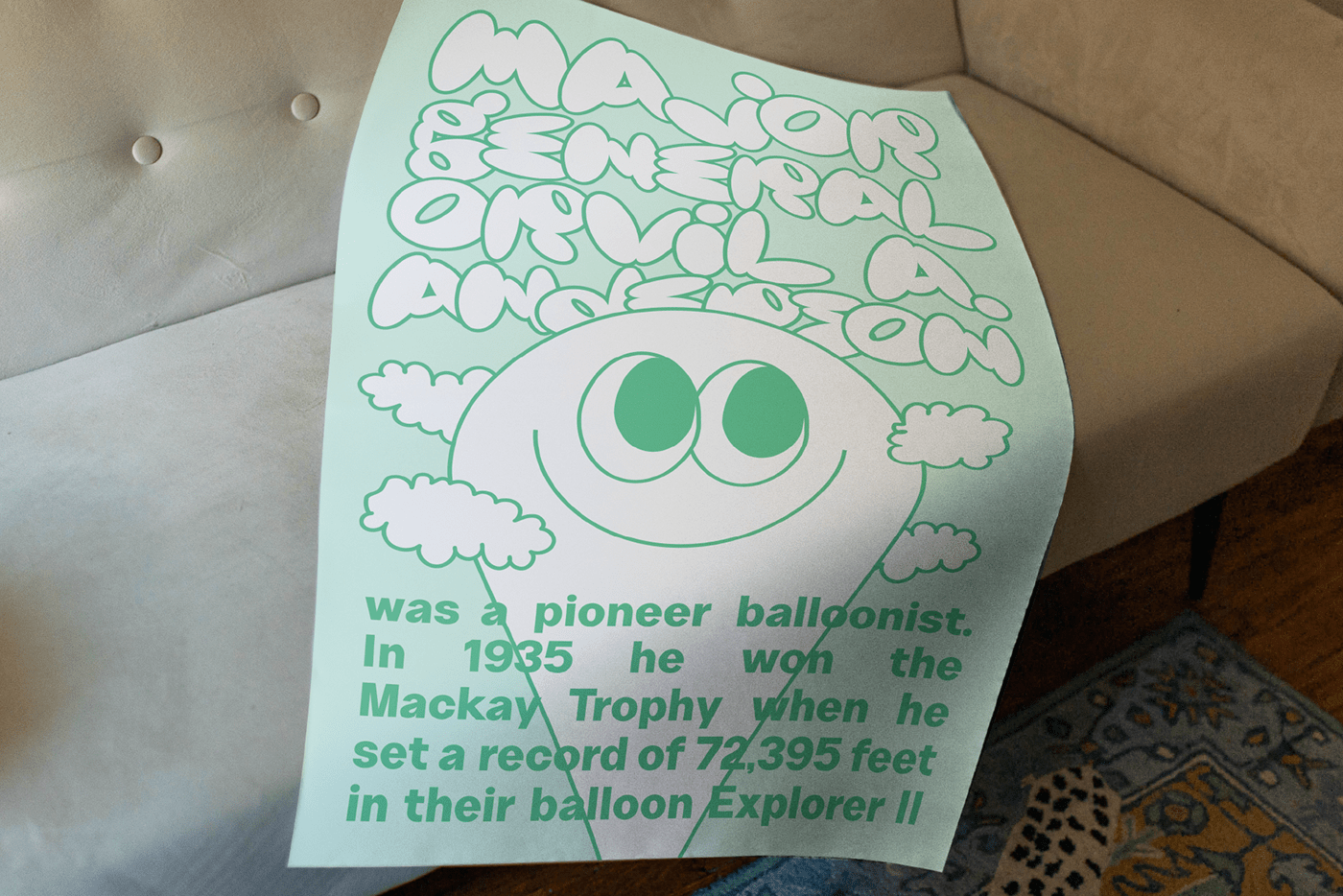 a poster wrapped over a couch of a balloon up in the clouds. 