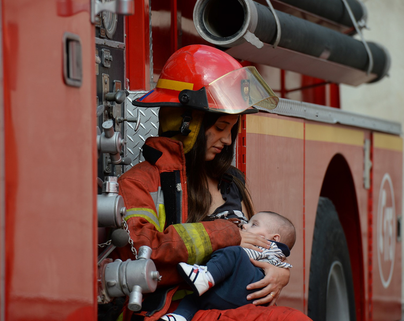 awareness baby breastfeeding campaign Firefighter mother