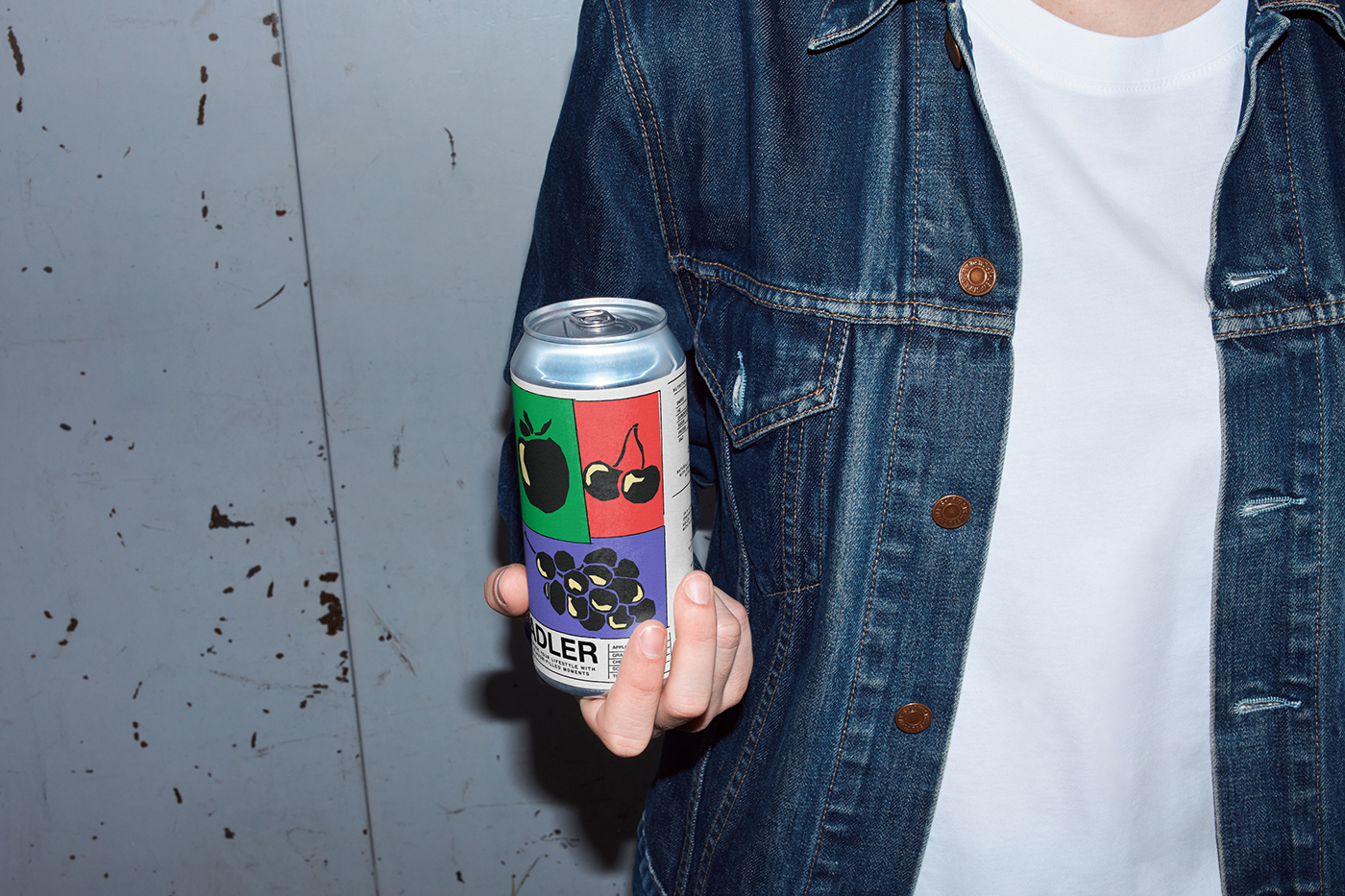 A photo of a can in hand in a  urban setting in a design brutal style. 
