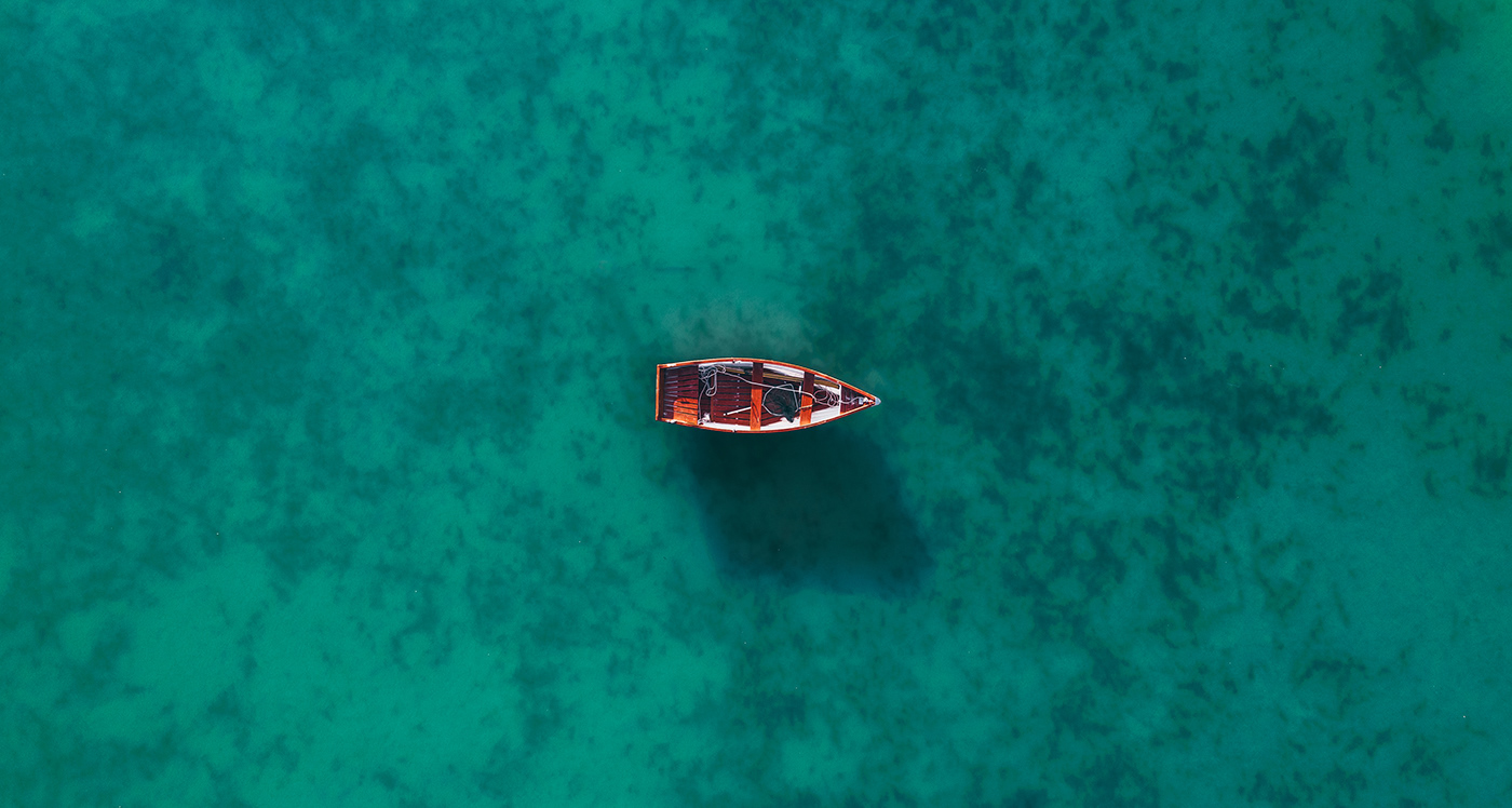 Lonely boat in the lake - aerial photo