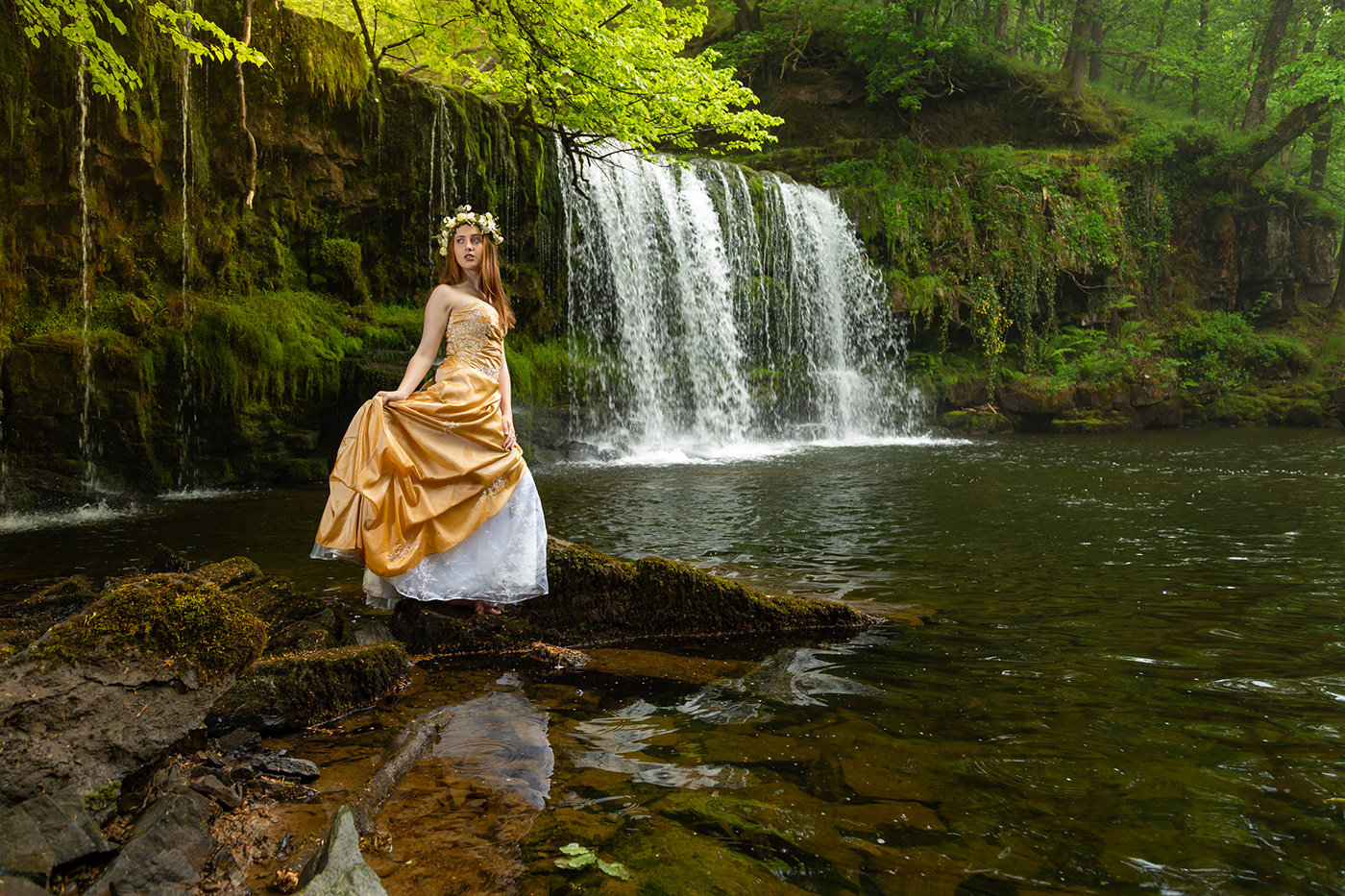 Beauty portraits in nature set against the waterfall and woodland in Wales