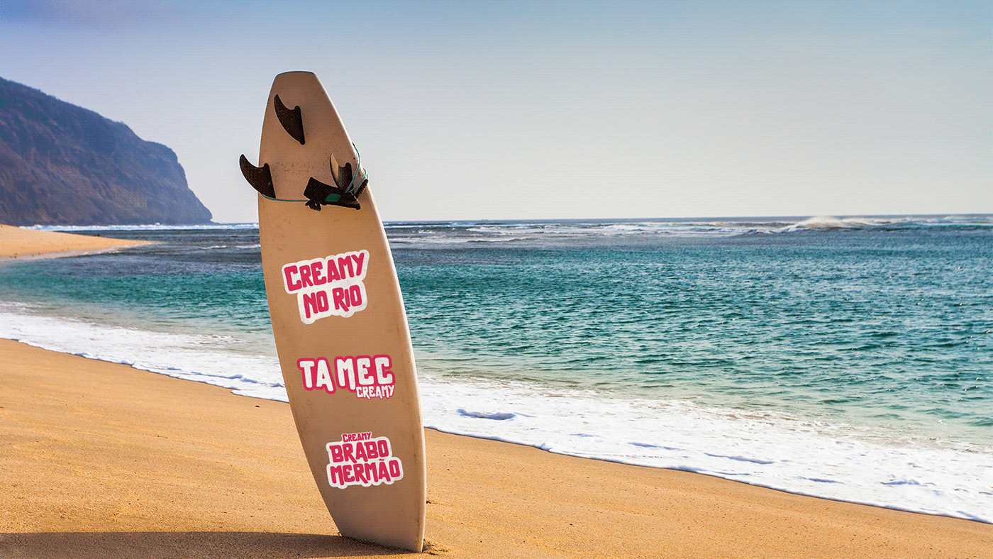 surfboard on the beach with creamy brand sticker