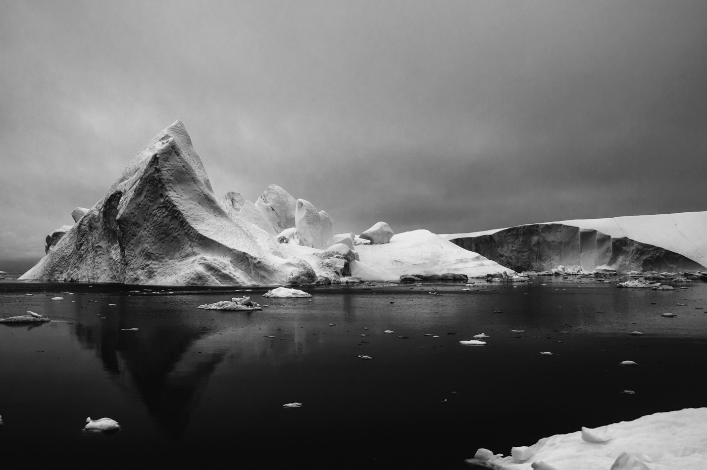 northlandscapes Arctic Greenland ice iceberg black & white Shadows snow sea Ocean water reflection clouds dark