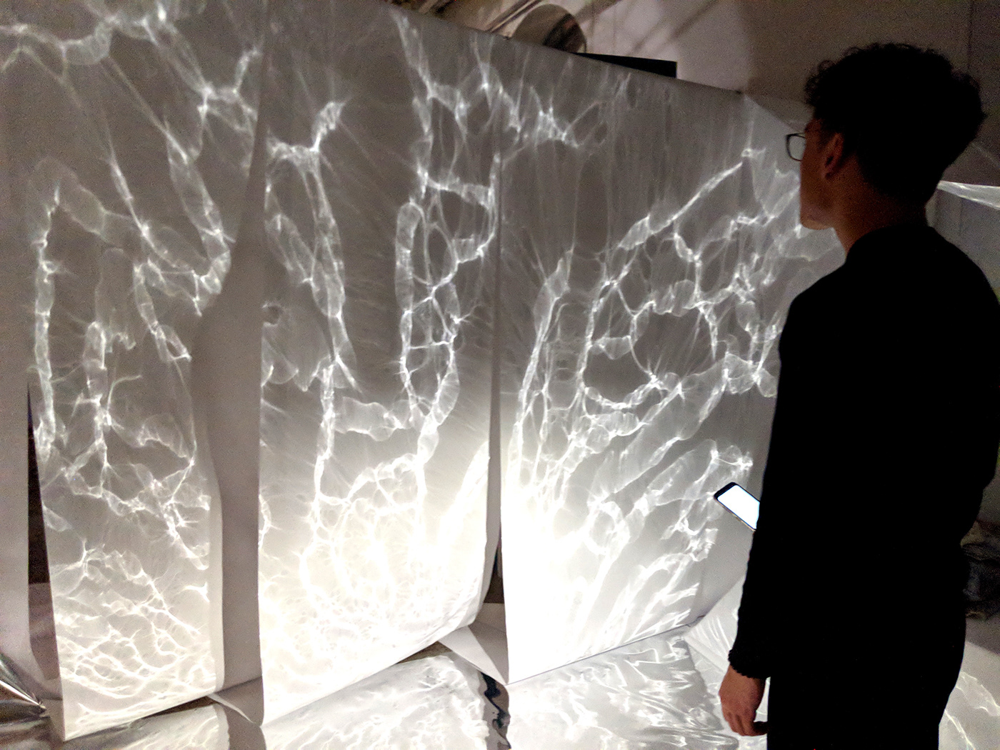 interactive installation reflective mylar interactive space phones light dark reflection