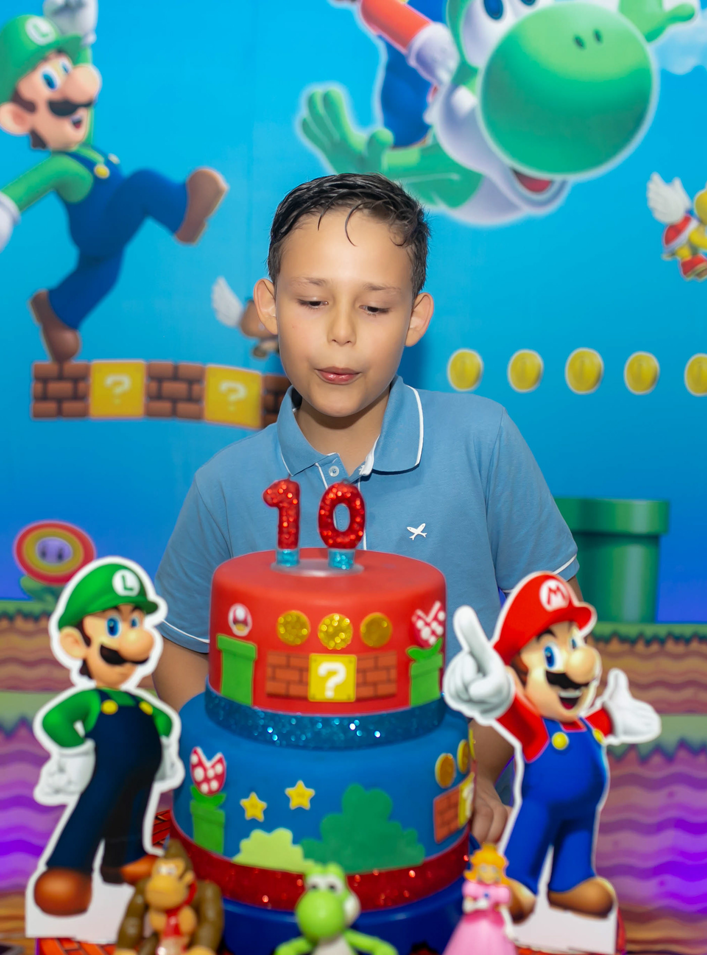 Image may contain: birthday cake, cartoon and boy
