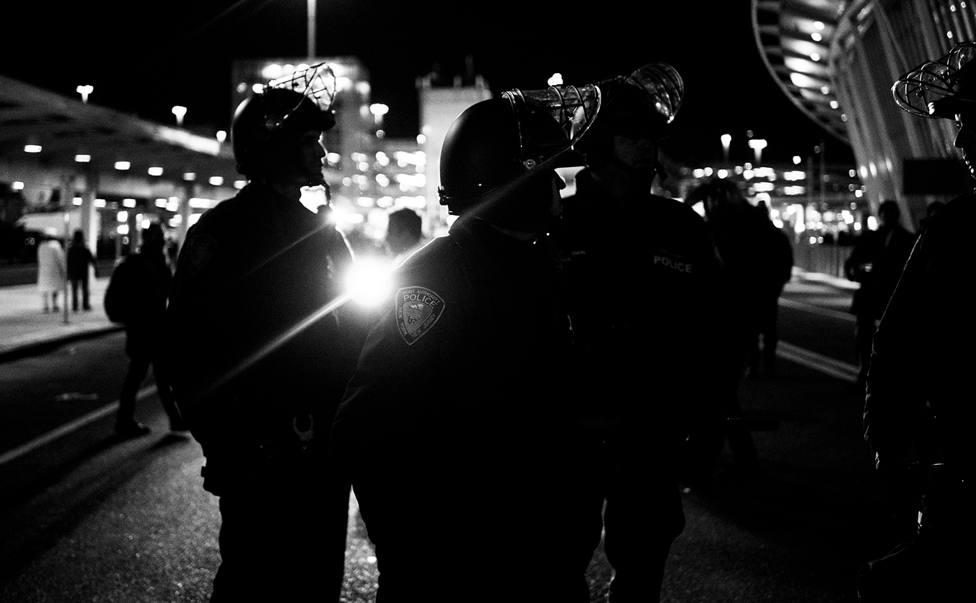 protest street photography night photography Terminal 4 Trump politics JFK NoBanNoWall black and white new york city