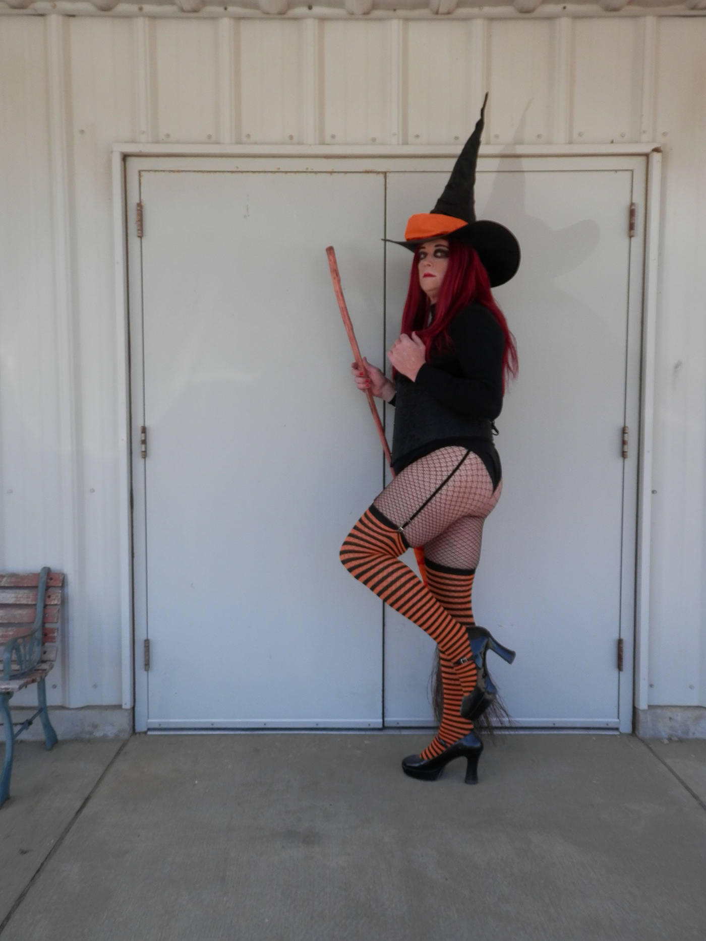 Halloween fishnets redhead model photoshoot Halloween2022 hay bales Jackolantern witch witchhat