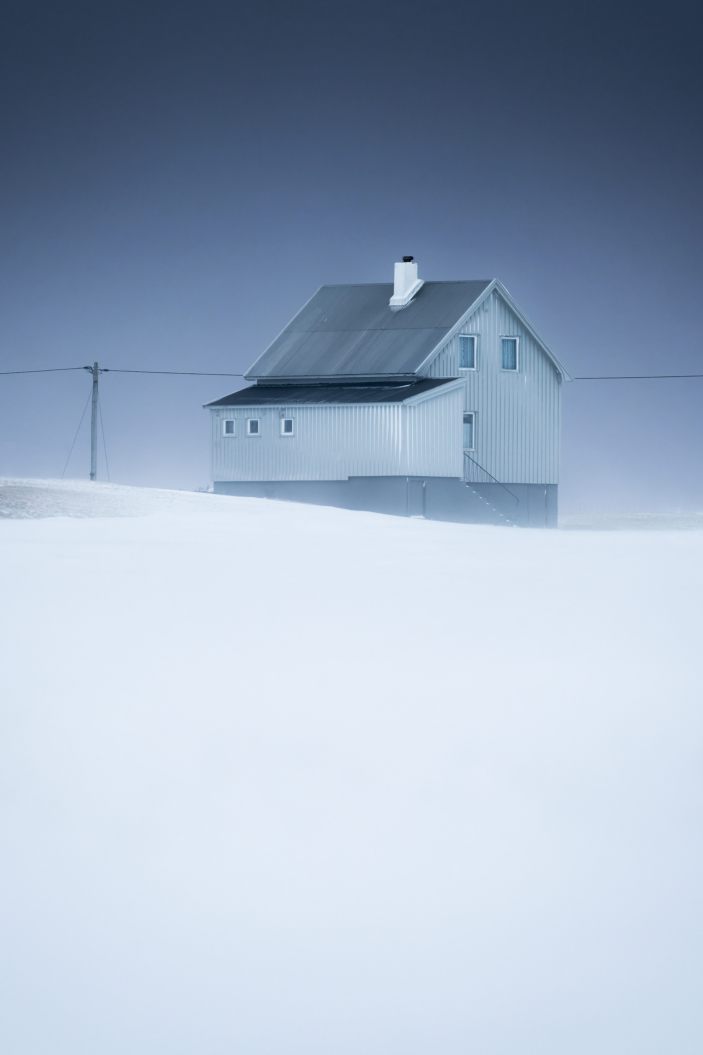 lofoten minimalist norway snow winter Arctic Circle cabin house snowstorm