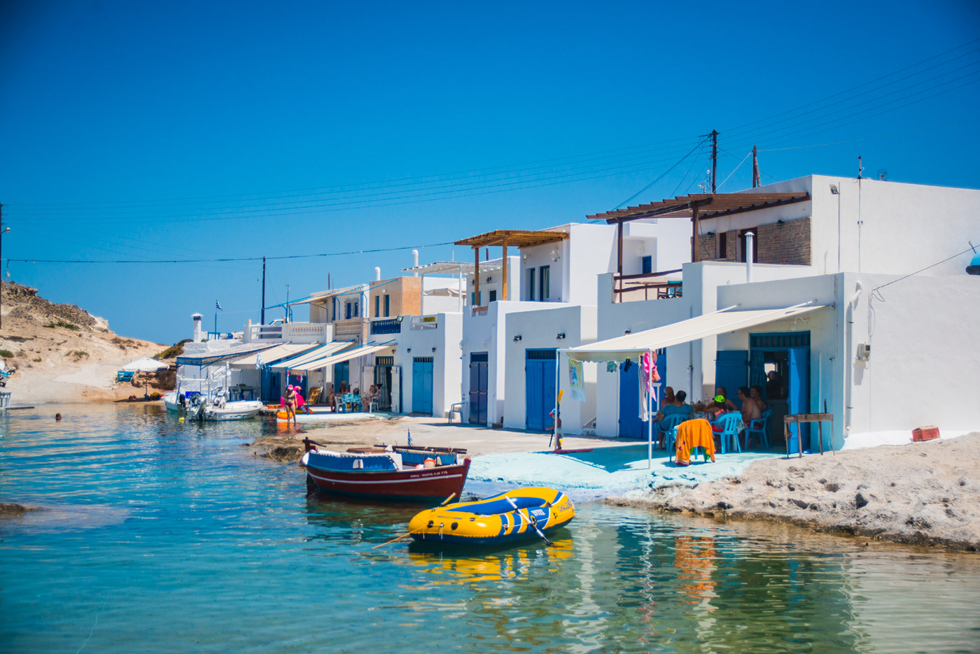 milos Greece vacation sea Island relax vivid colors people sunset Travel