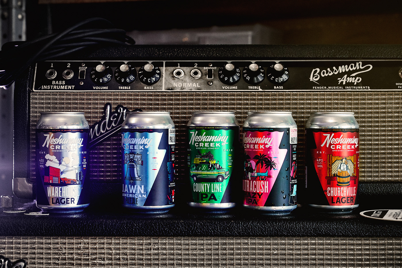NCBC core beer lineup pictured on a guitar amp.