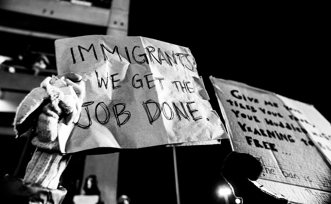 protest street photography night photography Terminal 4 Trump politics JFK NoBanNoWall black and white new york city