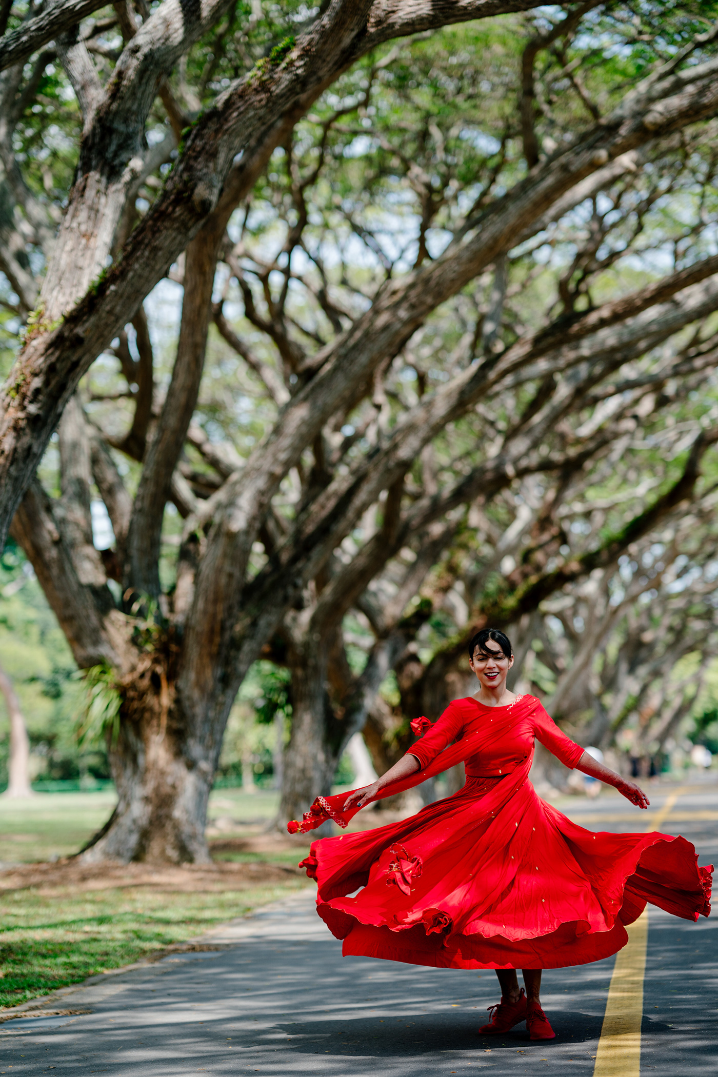 bride couple Outdoor portrait postwedding   red singapore twirling wedding