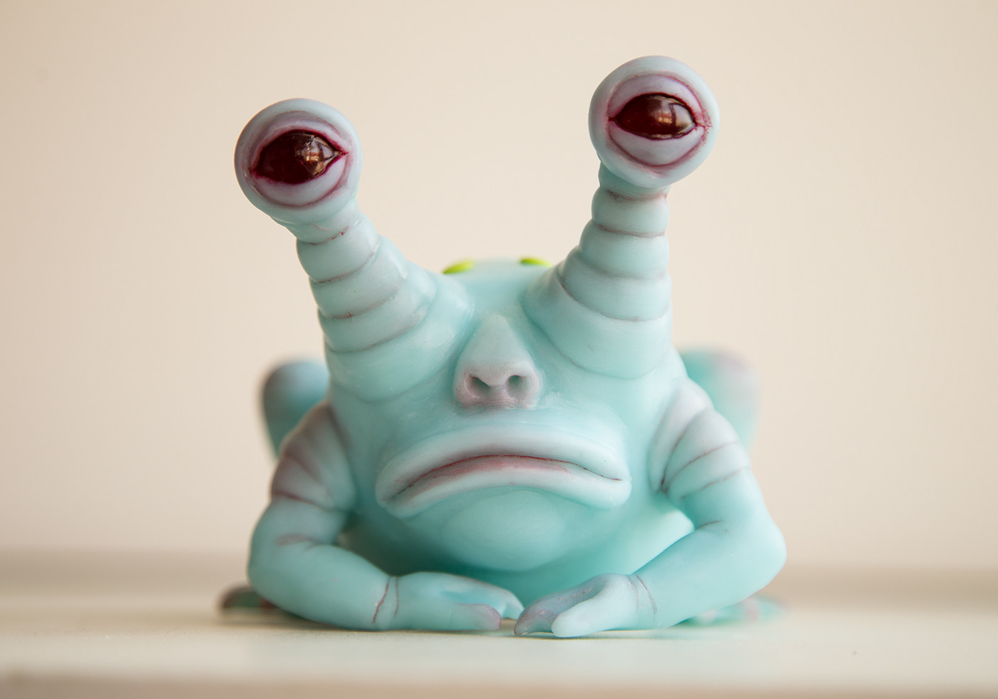 Sculptre of Blue and Sad frog