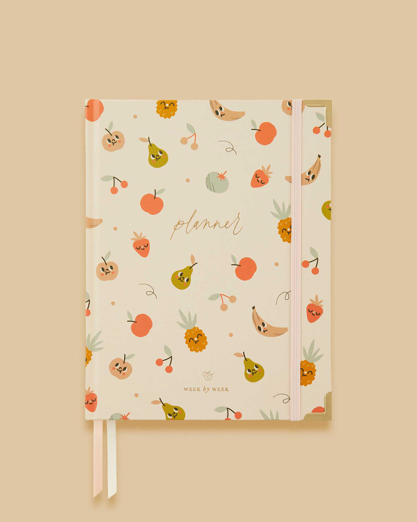 Image of a planner notebook with an illustrated seamless pattern of cute fruits on its cover
