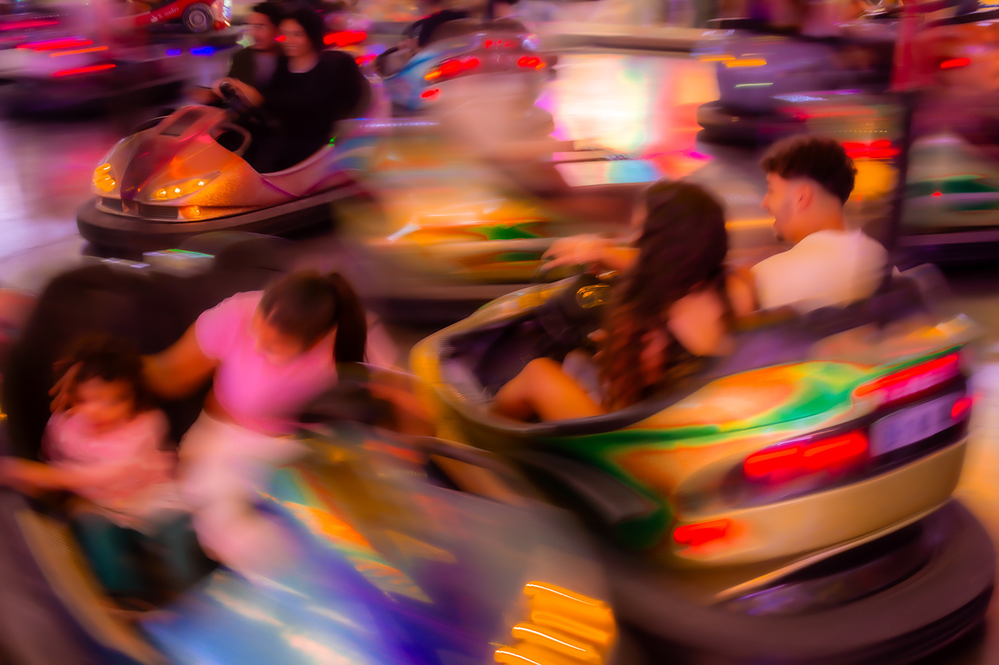 bumper cars colorful fun Fair people ICM abstract