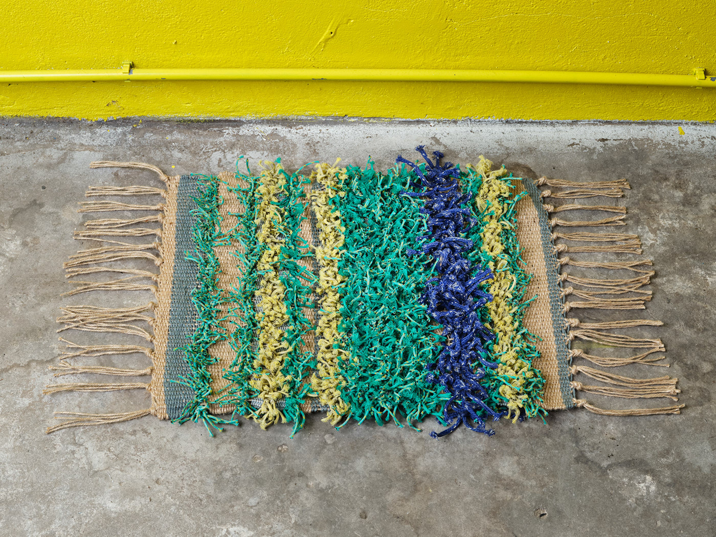 Sustainability recycled materials social design Hand weaving fishing net Collaborative project doormat design