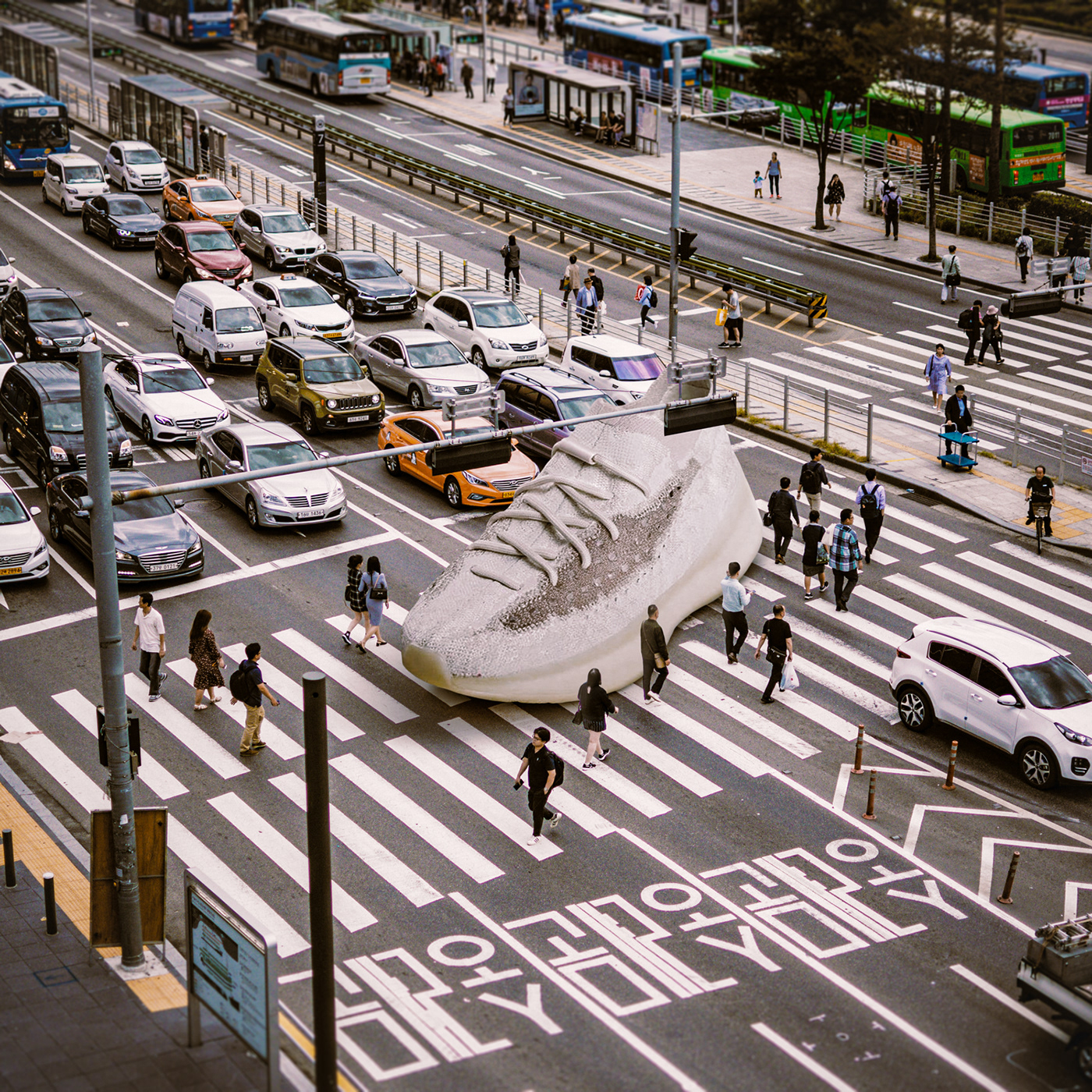 Giant sneaker photo composite. retouching and image manipulation done with photoshop