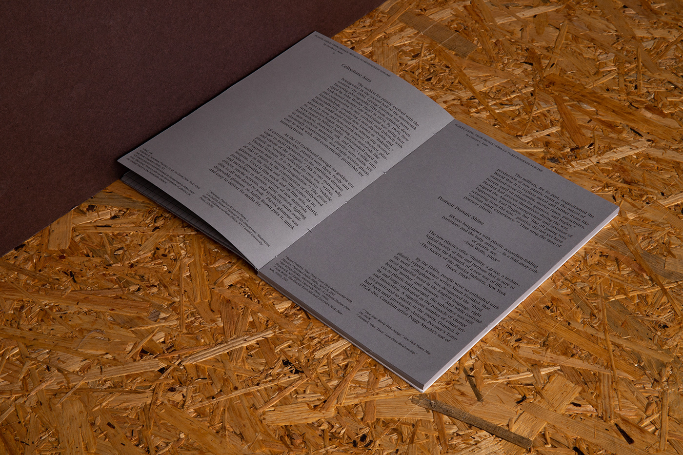 3D book design gray grid identity publication simple text