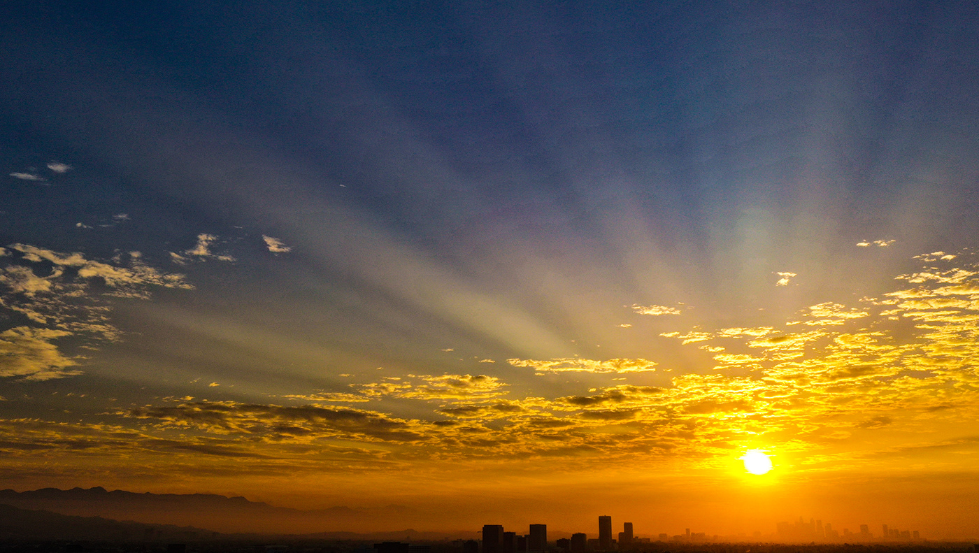 city-scape clouds COVID-19 Los Angeles orange Silhouette sun rays Sunrise