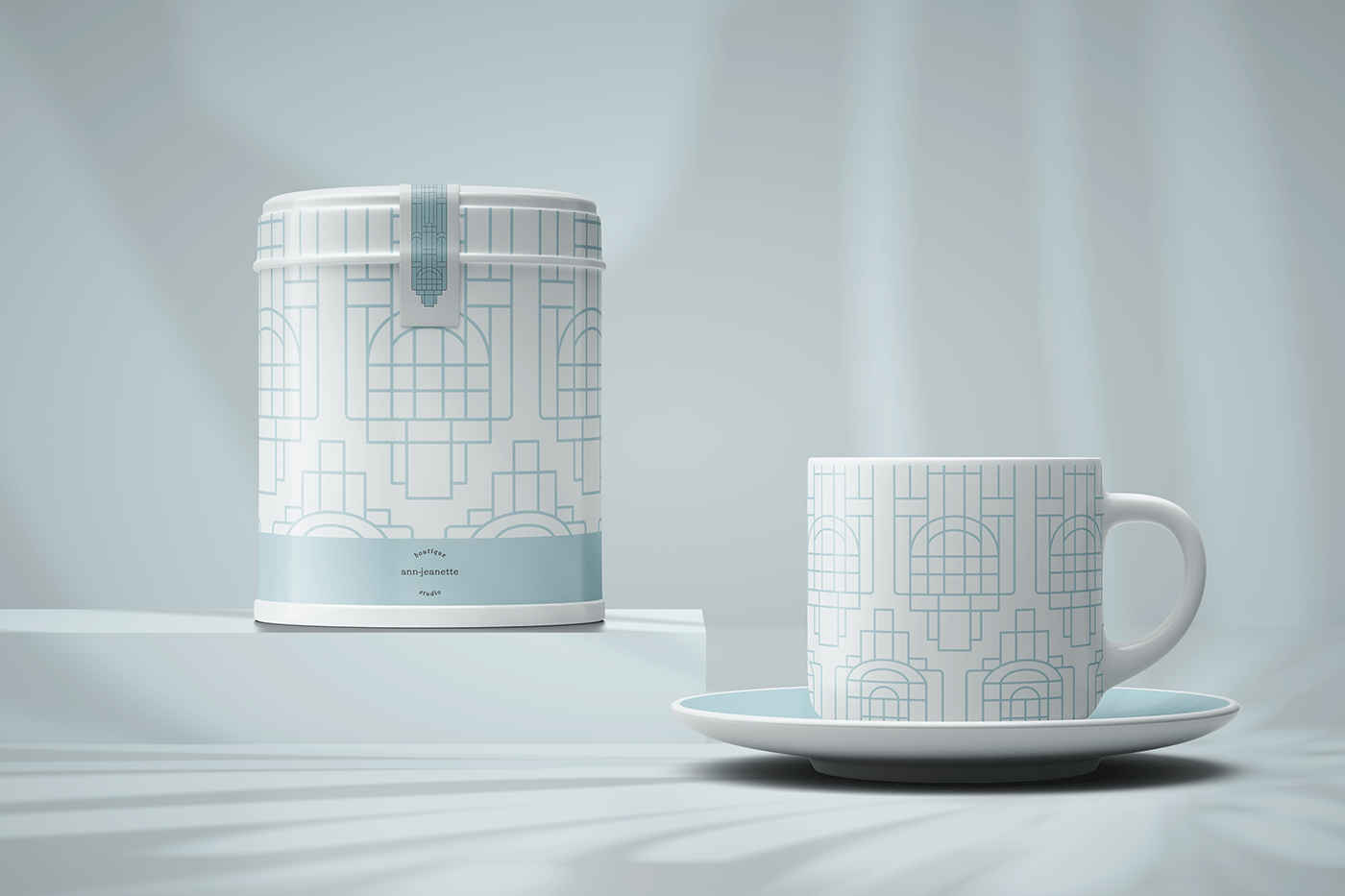 A tea cup on a tray, and a tea box showcasing the Art Deco Brand Pattern. 