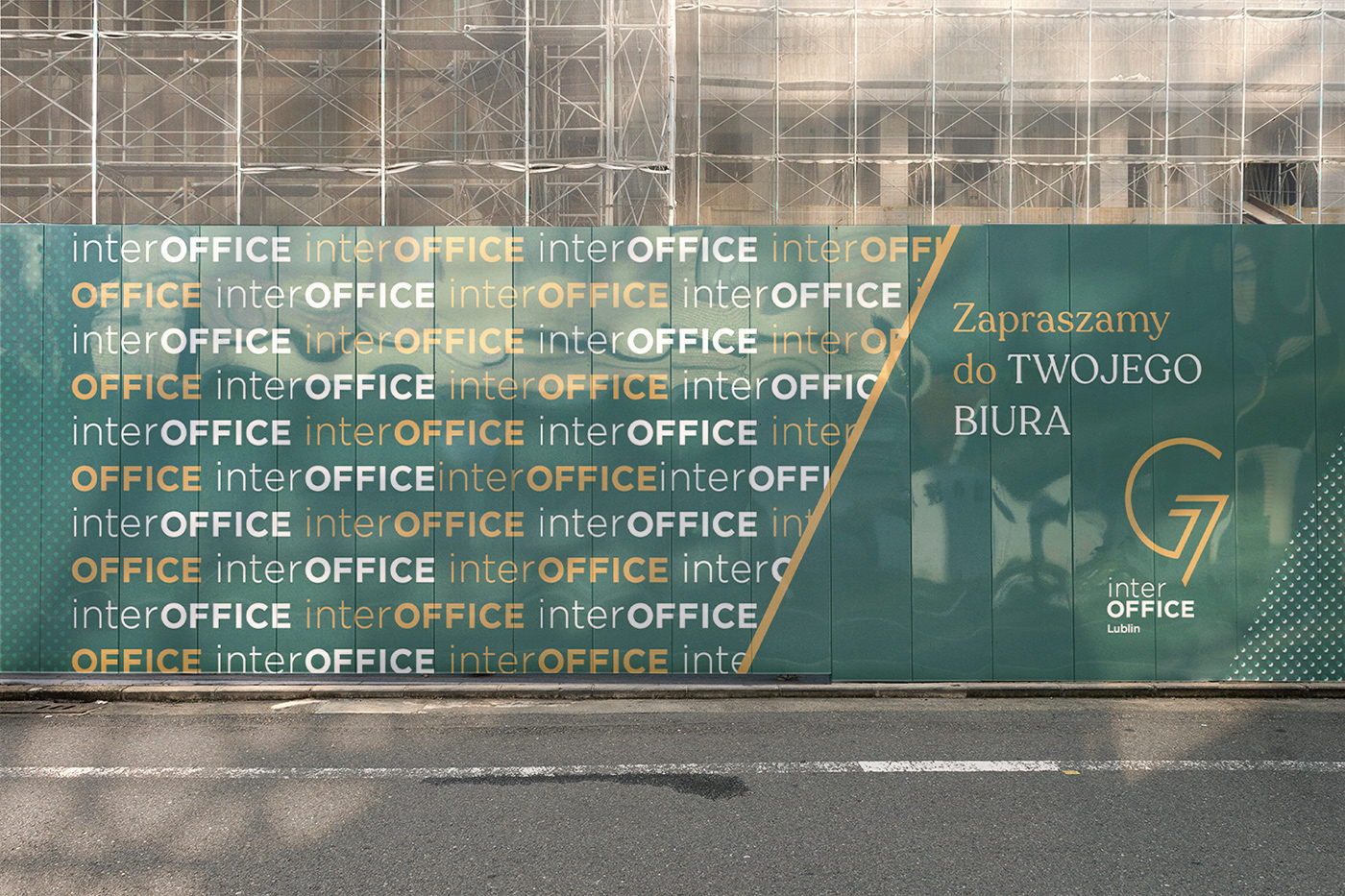 Hoarding of a construction site featuring green and golden graphics