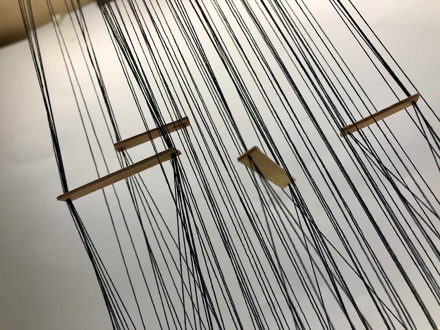 thin thread flexible surreal translucent light structure installation