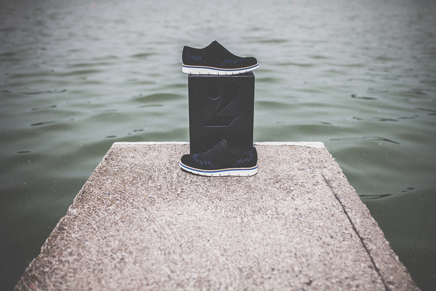 footwear photo art observation sea berlin water dark black silence shoes