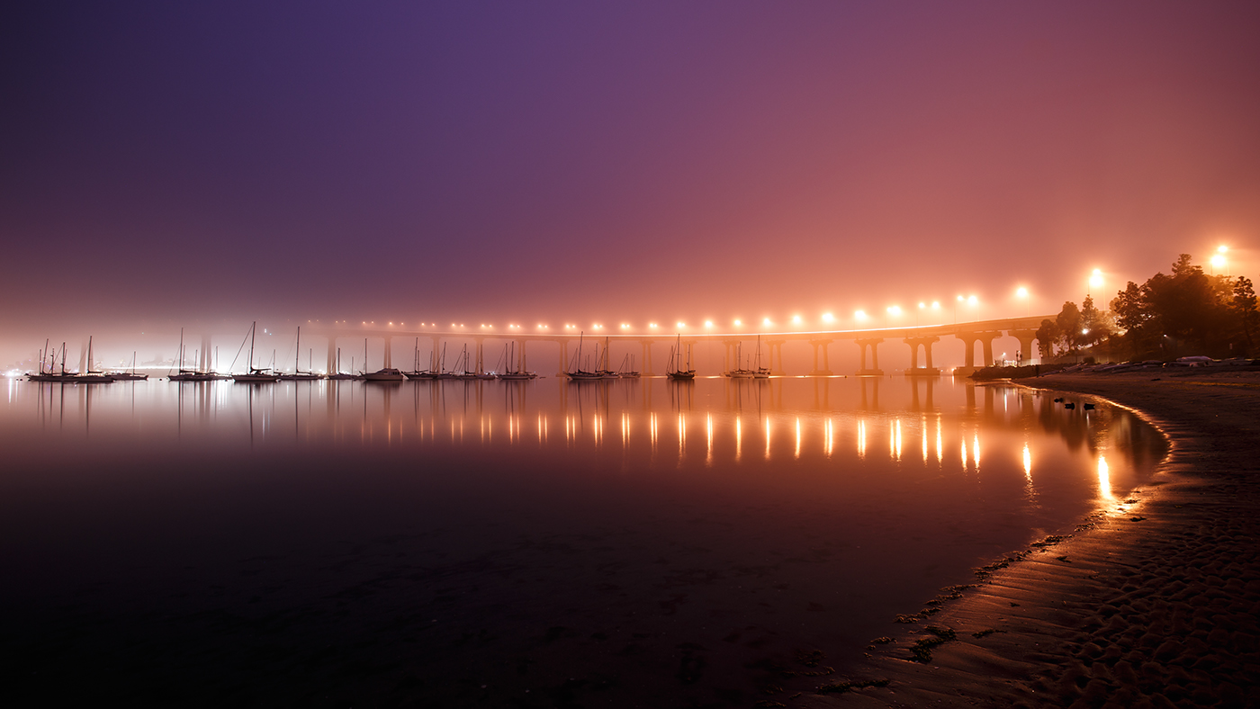 fog Moody bridge reflections Boats water night lights shoreline Still