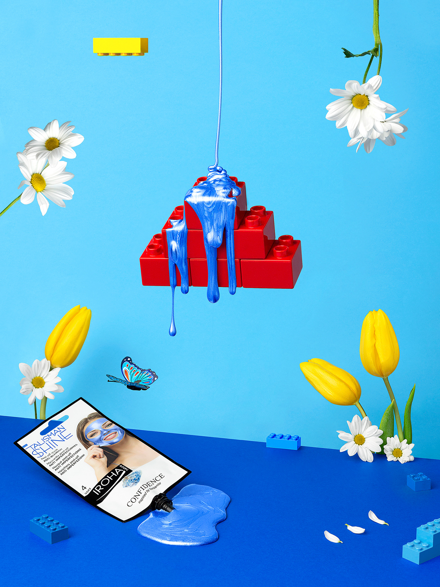 Colorful & playful advertising campaign: blue peel off mask pouring over a lego brick