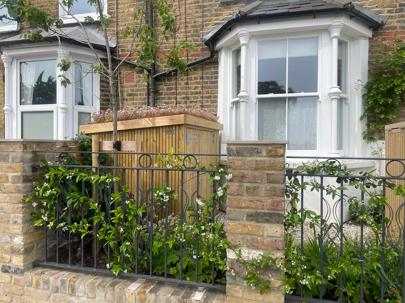 A beautiful but practical East London front garden with practical storage for a growing family