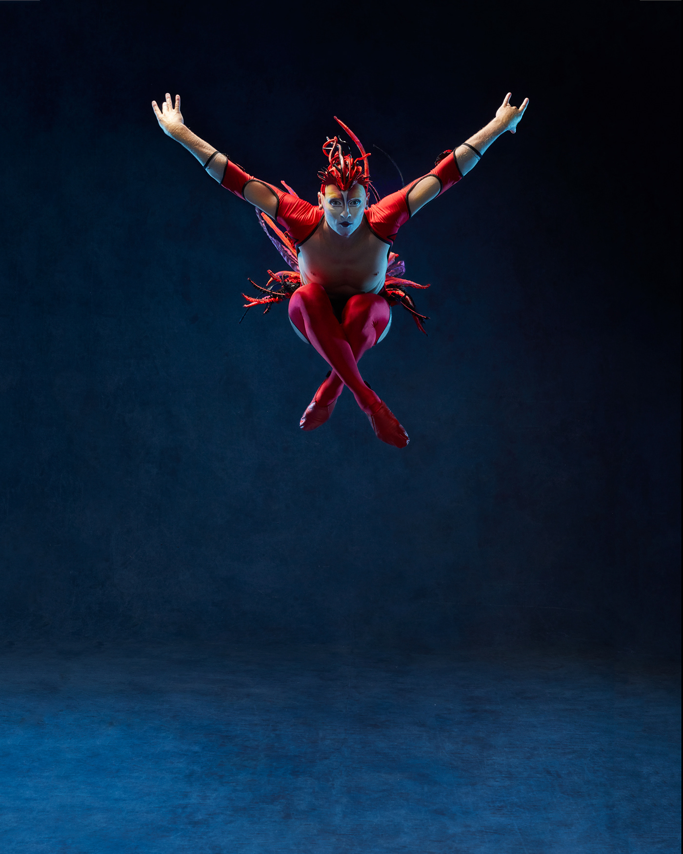 Photography  Circus acrobats jump blue