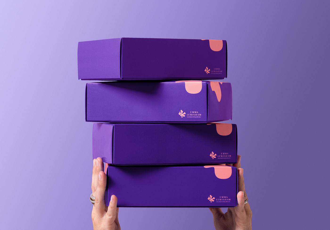 4 stacked purple ecommerce boxes for the natural skincare brand Emma Lewisham