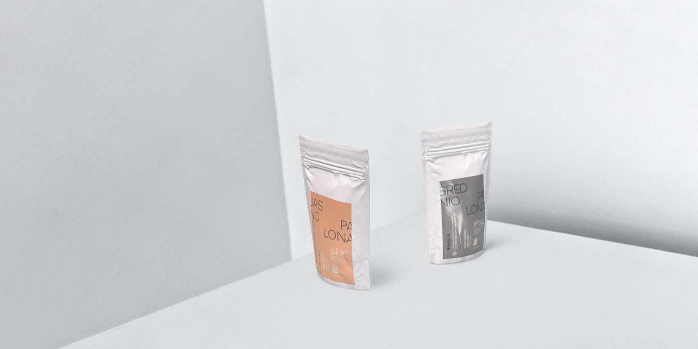 Two standing packs of coffee on a set composed of shades of white.