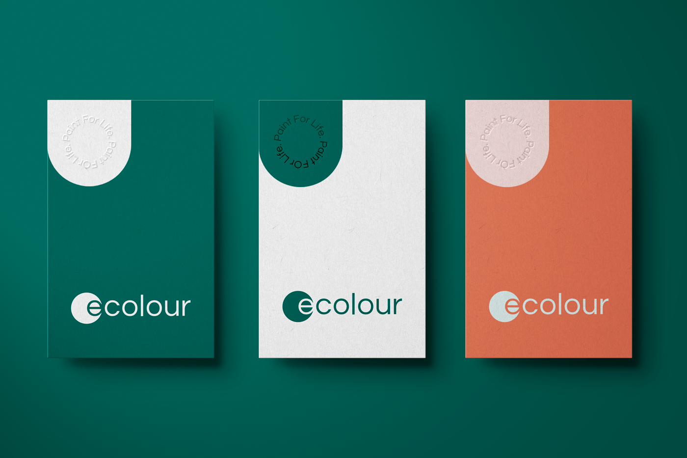 3 multi coloured business cards on deep green background.