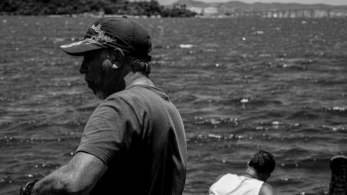black and white portrait water fishman Rio de Janeiro fishnet Brazil Ocean polution sea