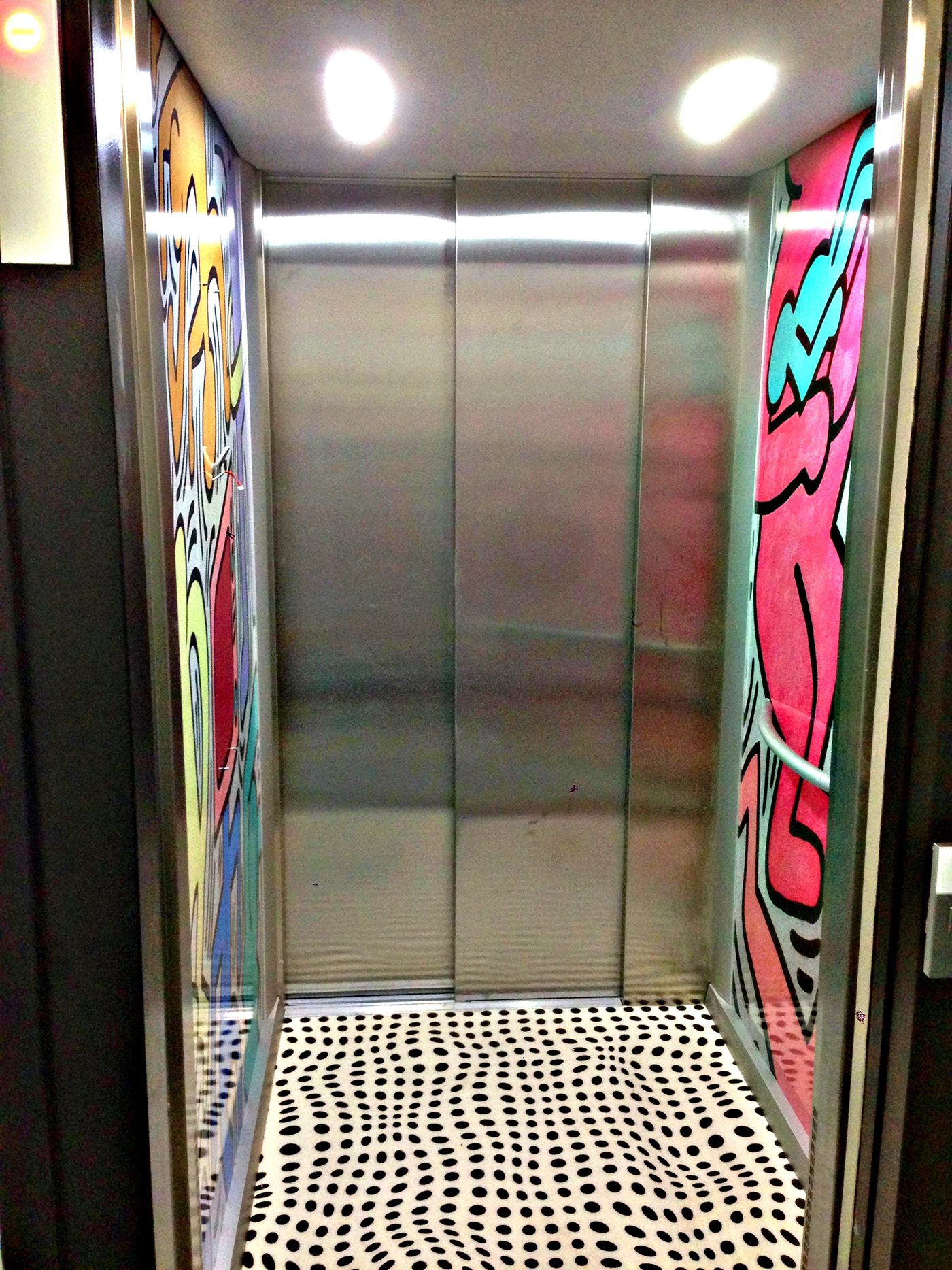 covering Ascenseur elevator graphic wall design keith haring