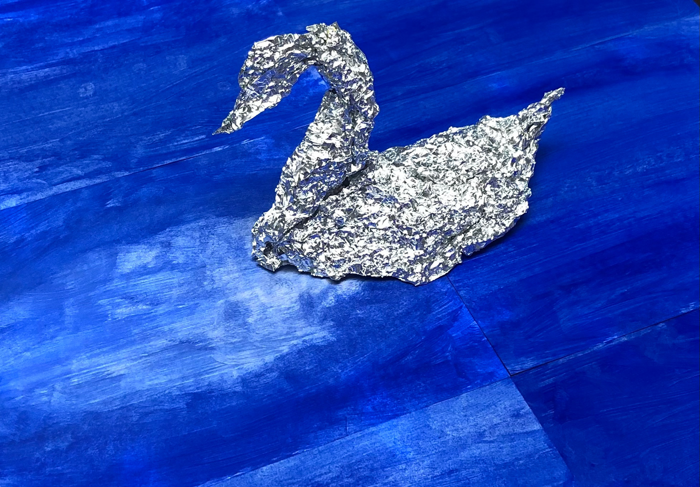 blue oil paints swan tinfoil water
