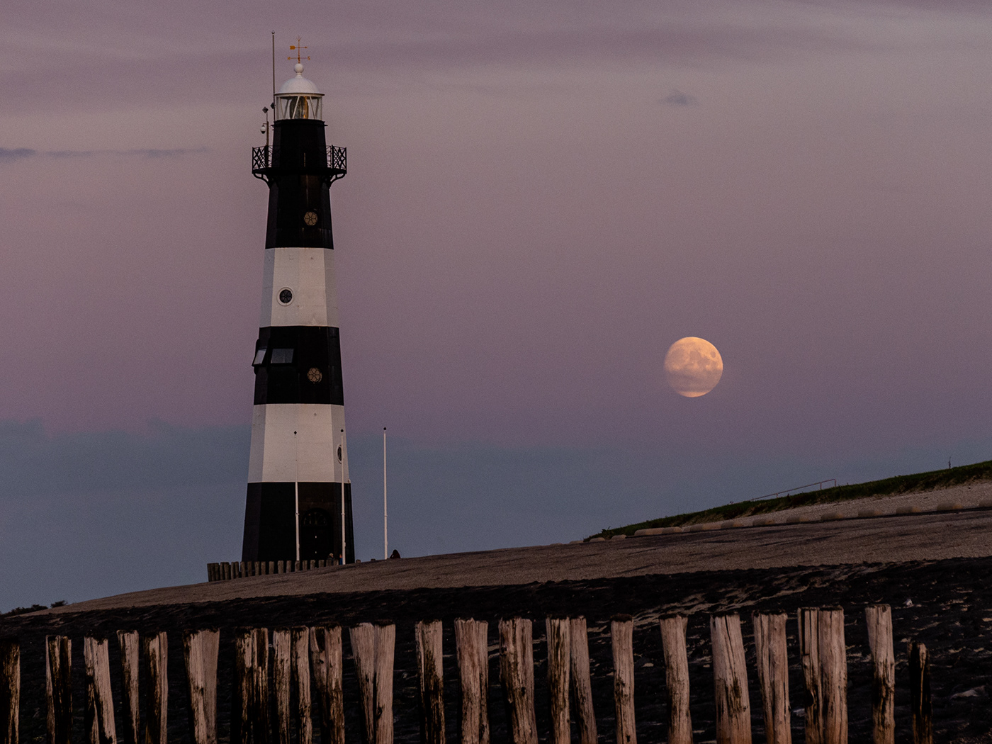 Lighthouse of Breksens with supermoon