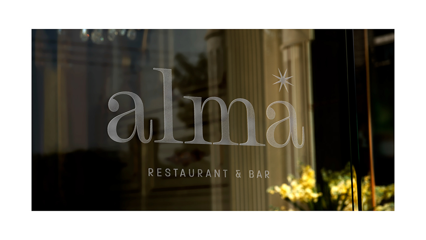 Stained glass logo of Alma's restaurant and bar brand identity.