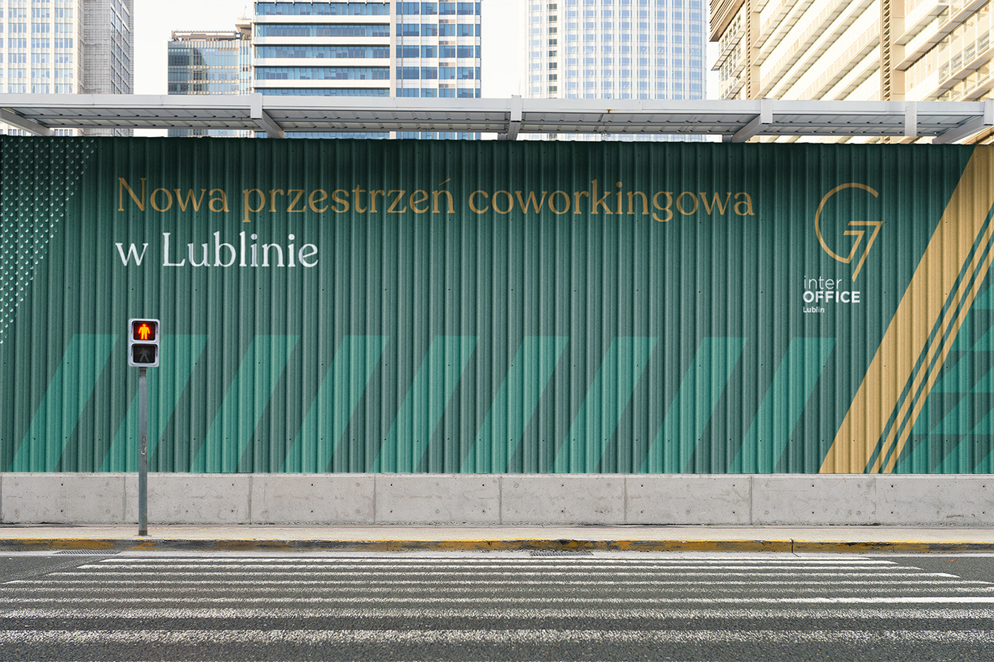 Hoarding covering a construction site featuring green and golden graphics.