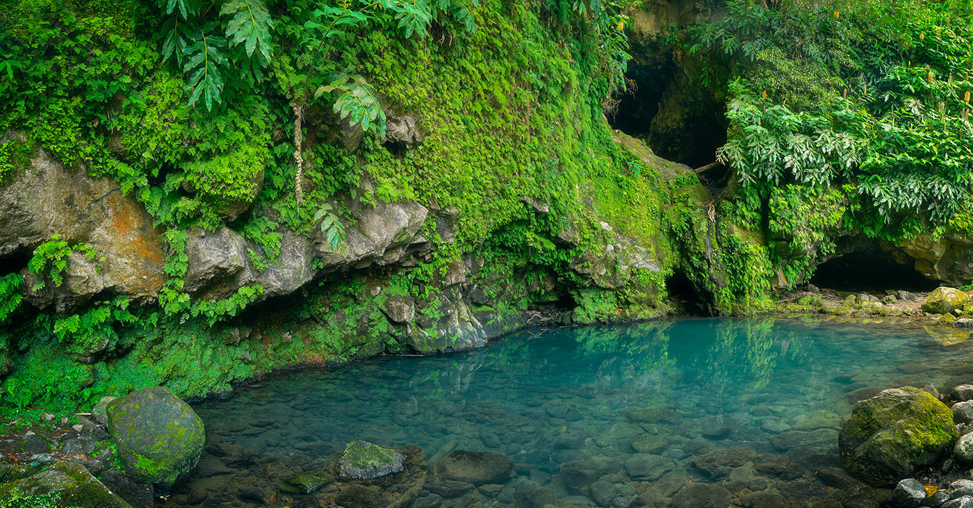 Panorama of the Poço Azul, a tiny blue lake located in the Azores.
