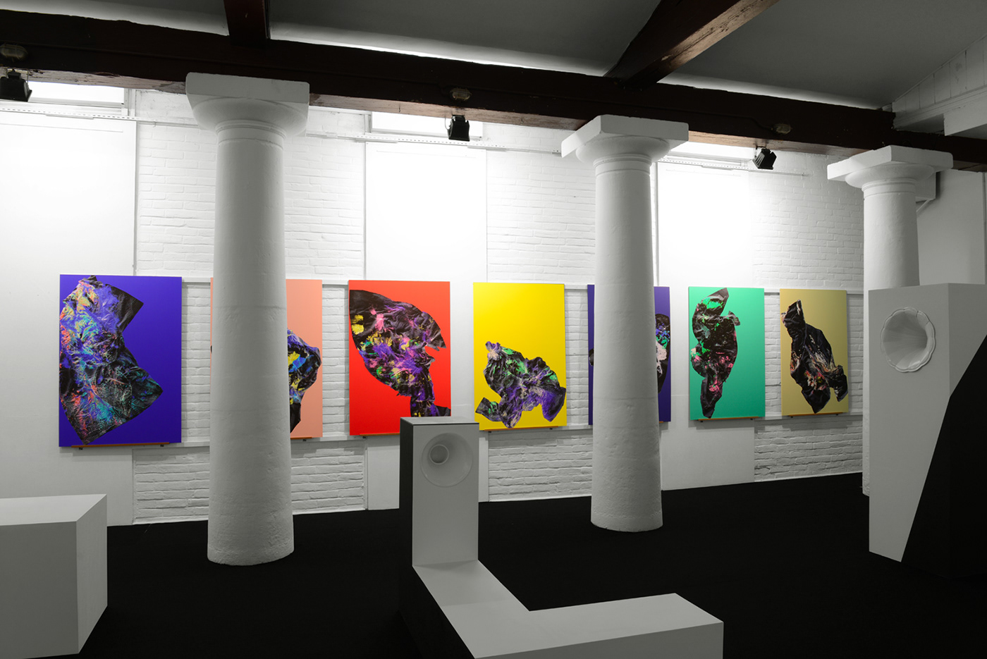 Installtion of seven digital paintings signed by two graphic designers