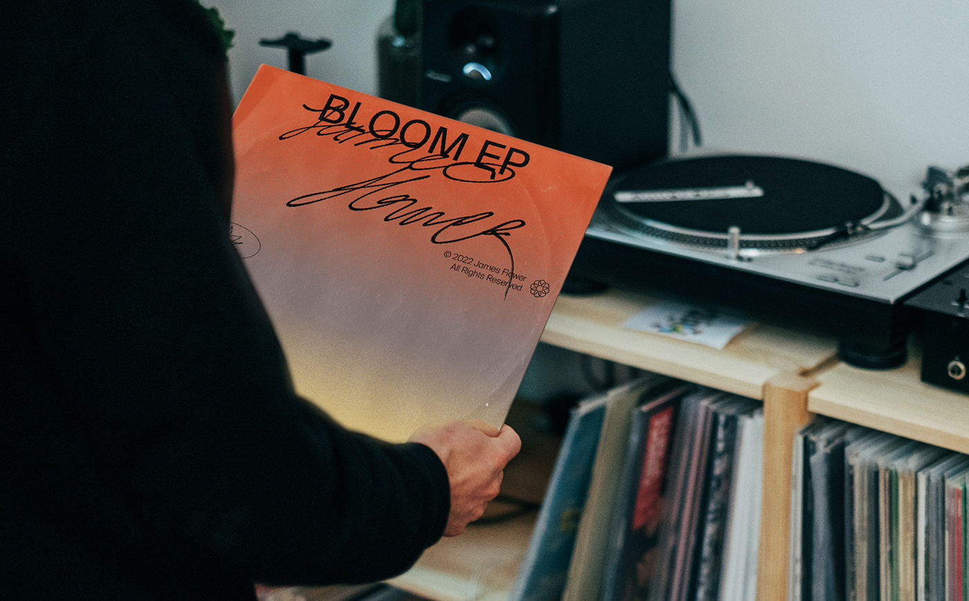 Man holding a vinyl of James Flower