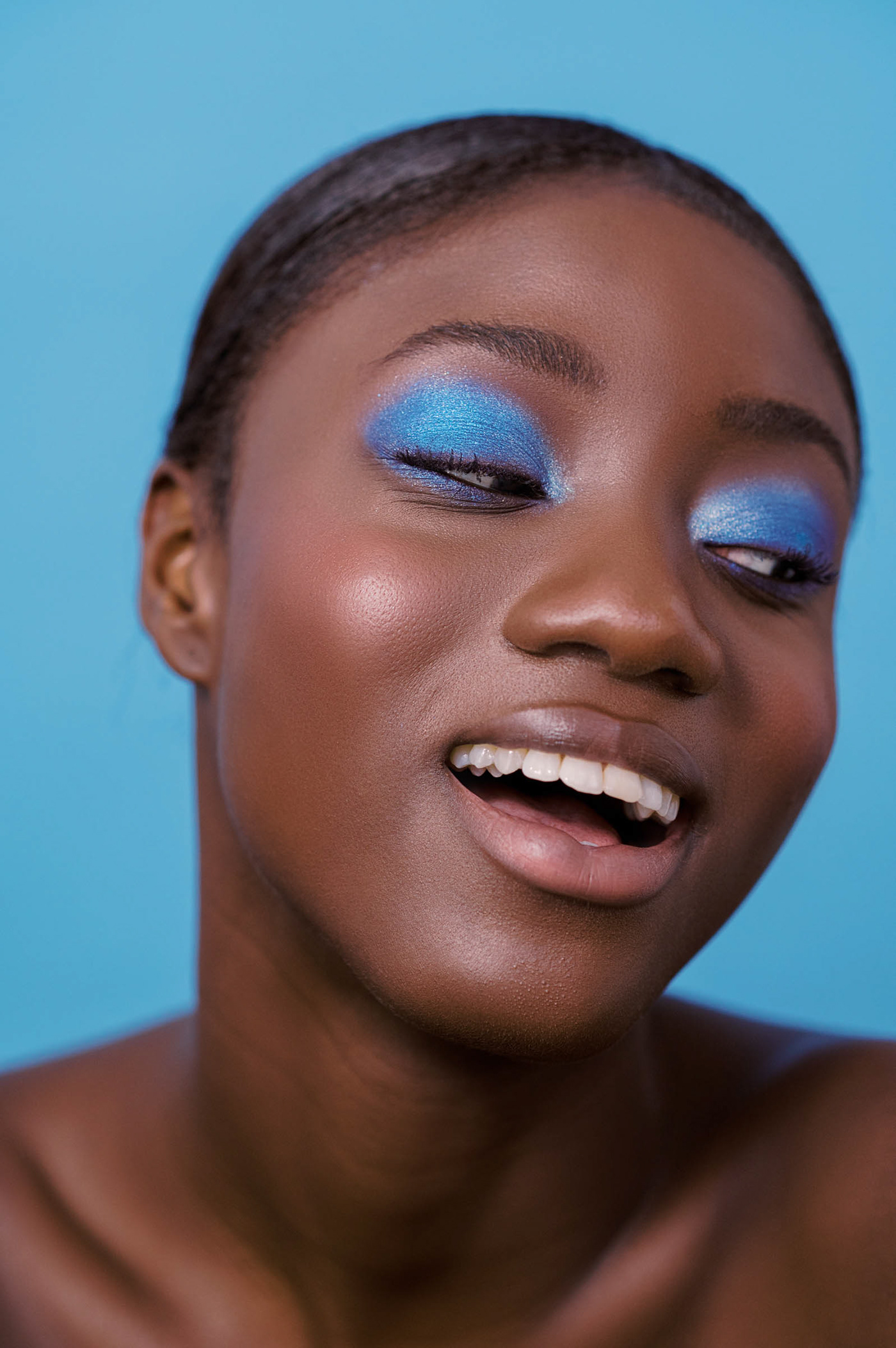 Shimmery eye-make up looks in different tones are the main focus of this beauty editorial.